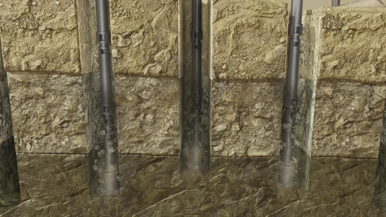 Cutaway of drill strings advancing through a mineralized rock zone